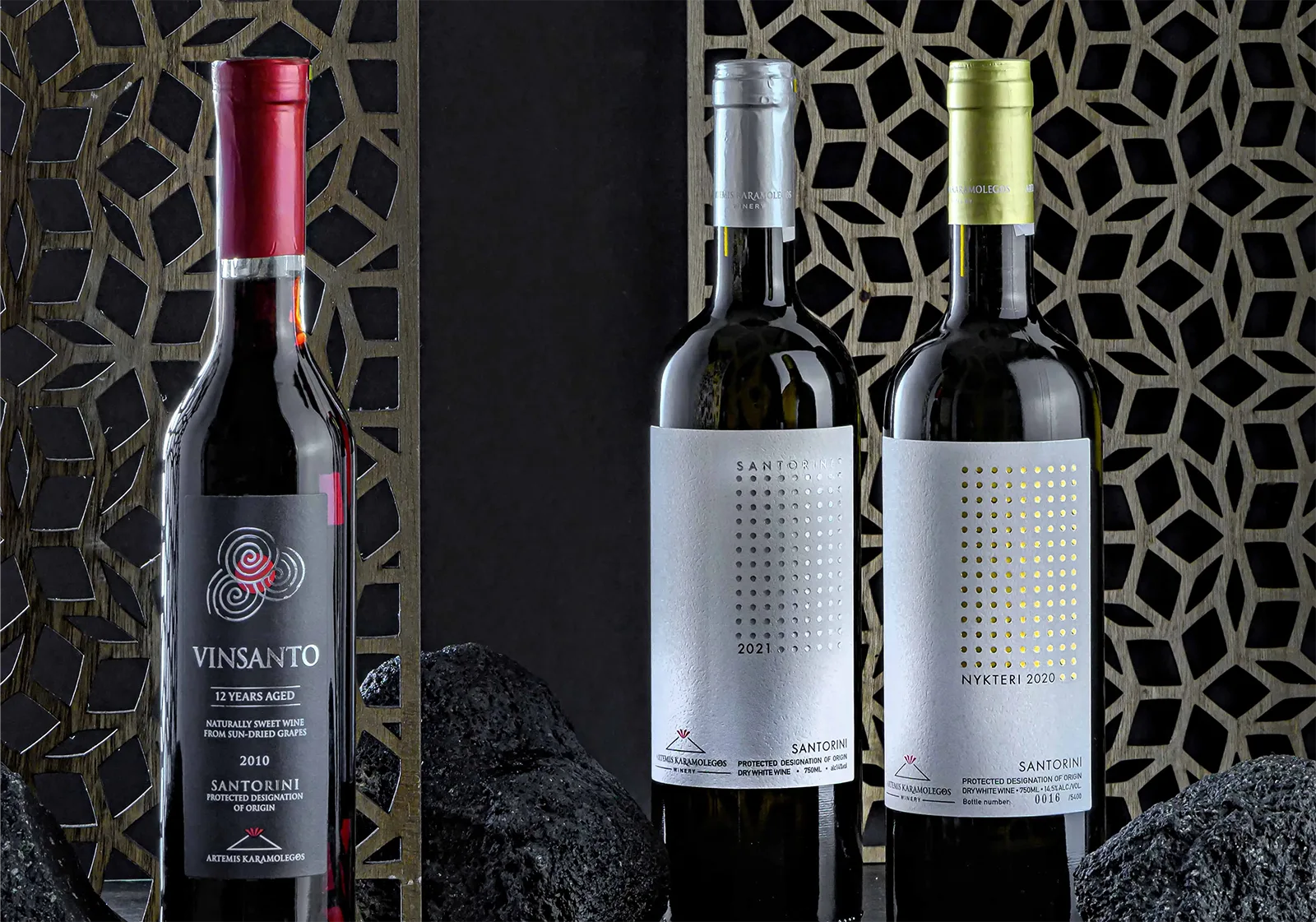 The Classics in a black background and three black stones of the volcanic soil.