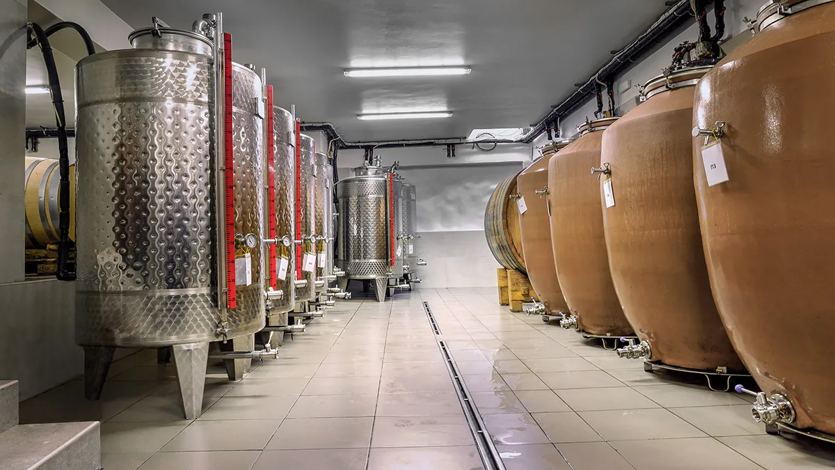 Clay vessels and stainless steel tanks in the winery.